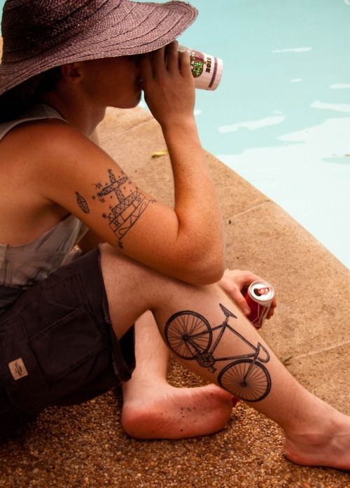Men’s drinking cola and bicycle tattoo on leg
