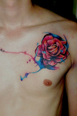 Men’s pink flower tattoo on chest