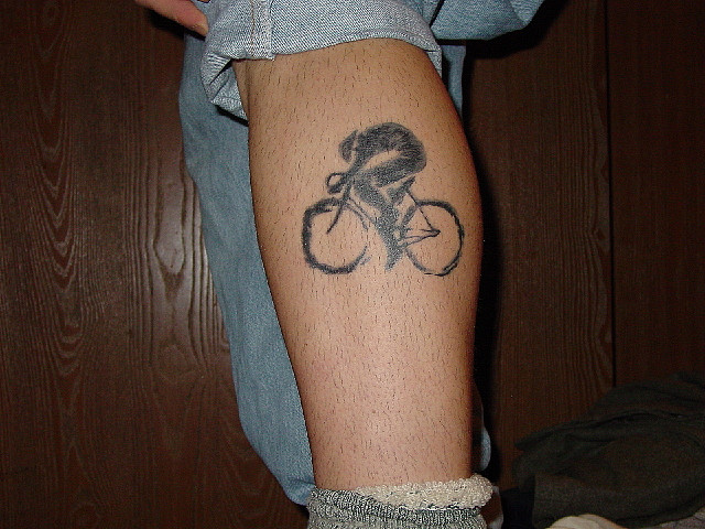 Men’s simple bicycle tattoo on leg