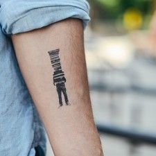 Men's with a lot of book tattoo on arm