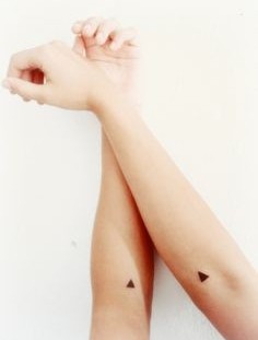 Minimalistic triangles tattoos