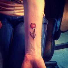 Minimalistic tulip tattoo