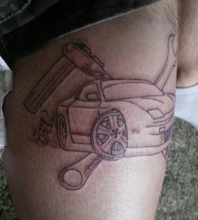 Modern style car tattoo on leg