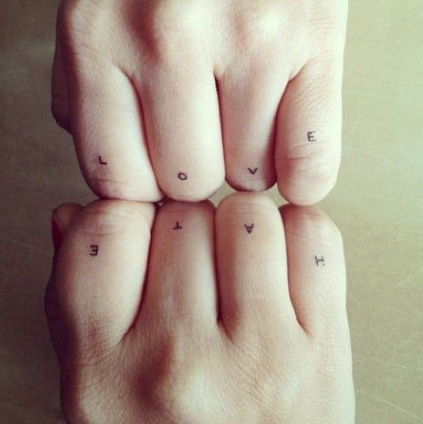 Modern style quote tattoo on finger