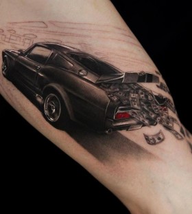 Money and black car tattoo on leg