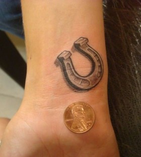 Money and horse shoe tattoo