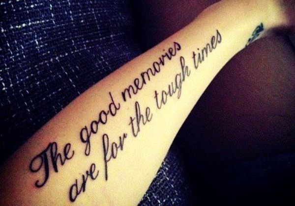 Motivational black quote tattoo on arm