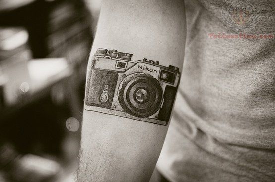 NIkon awesome camera tattoo on arm