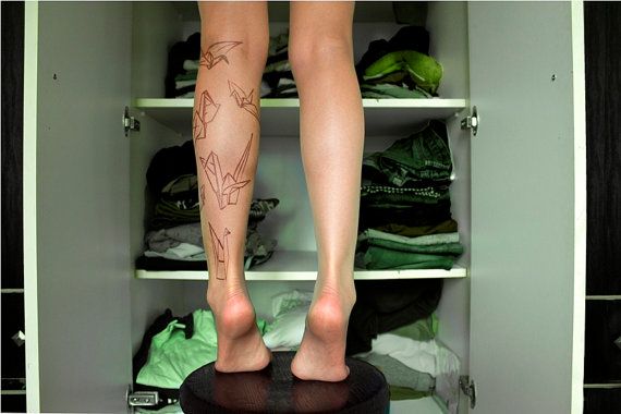 Paper art origami tattoo on leg