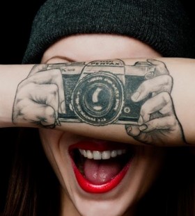 Pentax lovely camera tattoo on arm