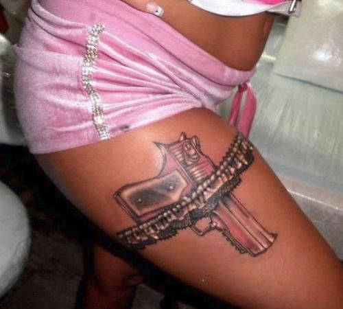 Pink lovely gun tattoo