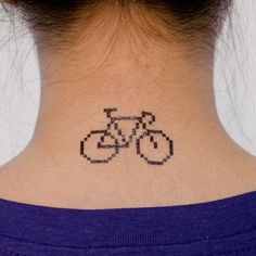 Pixel bicycle tattoo