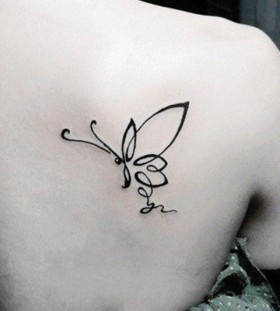Pretty black butterfly tattoo on shoulder