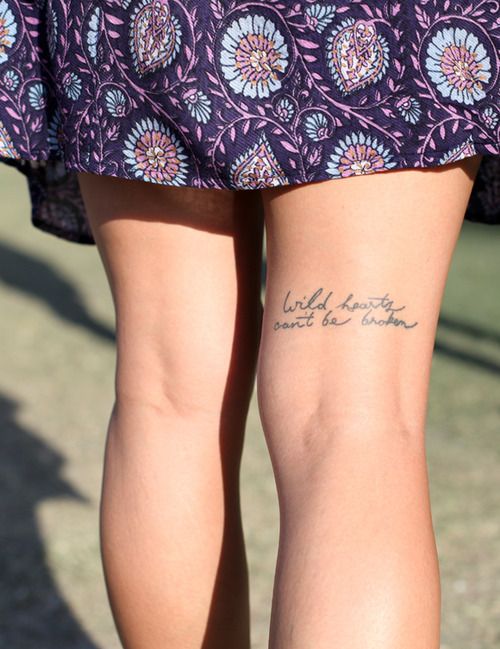Pretty black quote tattoo on leg