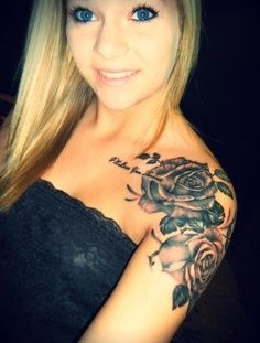 Pretty blonde girl rose tattoo on shoulder
