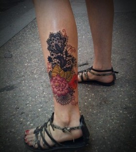 Pretty colorful lace tattoo on leg