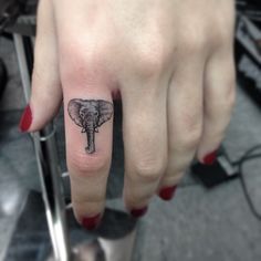 Pretty elephant tattoo on finger