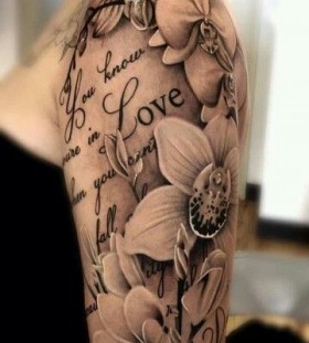 Pretty flowers quote tattoo on arm