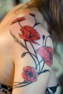 Pretty girl poppy tattoo on arm