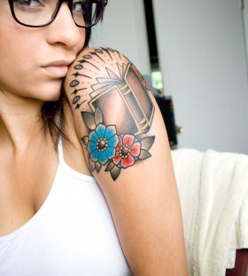 Pretty girl with glasses book tattoo on arm