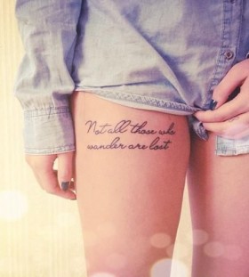 Pretty girl's quote tattoo on leg