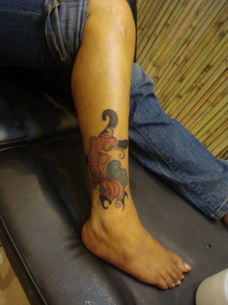 Pretty simple fish tattoo on leg