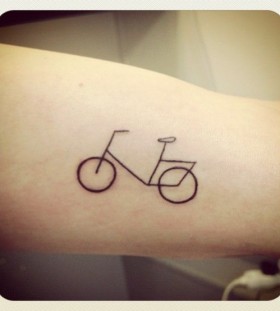 Pretty small bicycle tattoo on arm