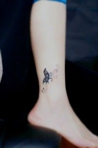 Pretty small butterfly tattoo on leg