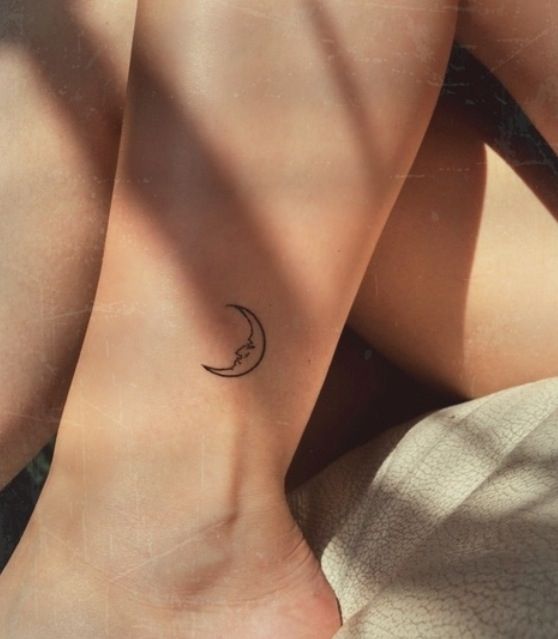 Pretty small moon tattoo on arm