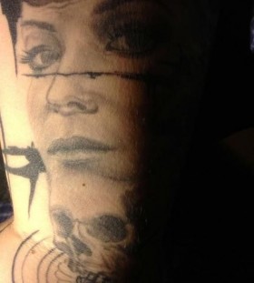 Pretty women face tattoo on arm