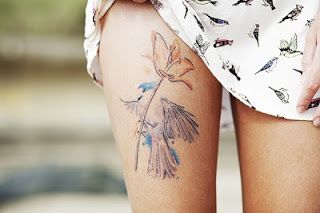 Pretty women flower and bird tattoo on leg