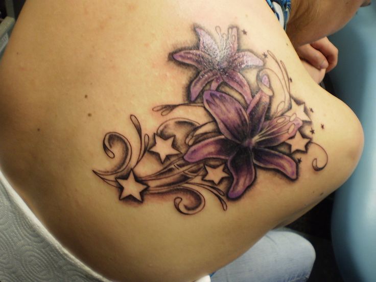 Purple flower and star tattoo on shoulder