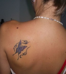 Purple girl butterfly tattoo on shoulder