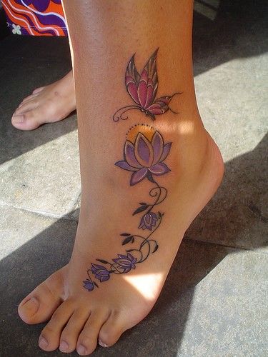 Purple simple butterfly tattoo on leg