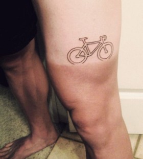 Race bike tattoo on leg