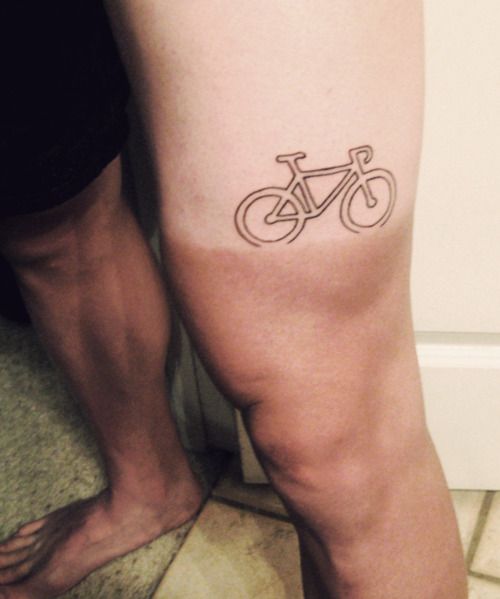 Race bike tattoo on leg