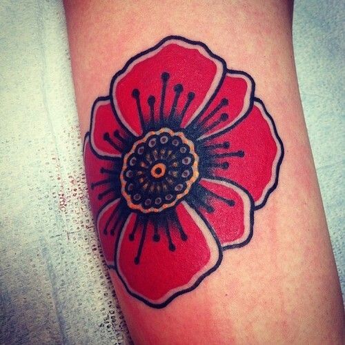 Red awesome poppy tattoo on leg