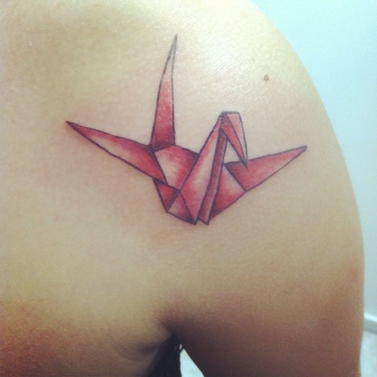 Red bird origami tattoo on shoulder