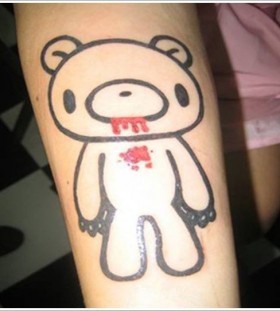 Red blood and black bear tattoo on arm