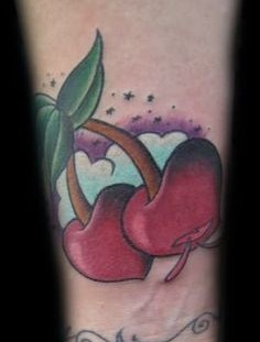 Red, delicious cherry tattoo on arm