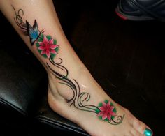 Red flowers and line tattoo on leg