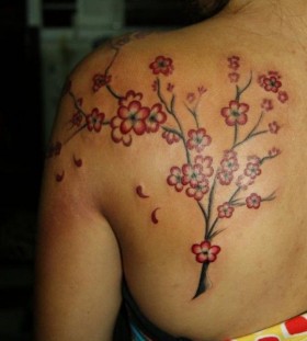 Red flowers tree tattoo on shoulder