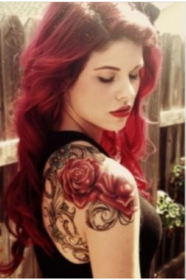 Red hair women rose tattoo on shoulder