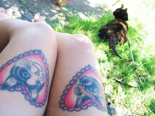 Red heart cat tattoo on leg