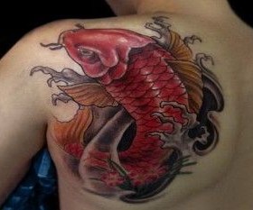 Red koi fish tattoo on arm