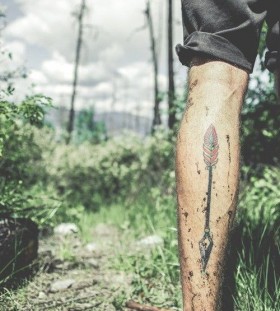 Red leafs tribal tattoo on leg