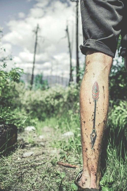 Red leafs tribal tattoo on leg