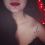 Red lips girl's moon tattoo on shoulder