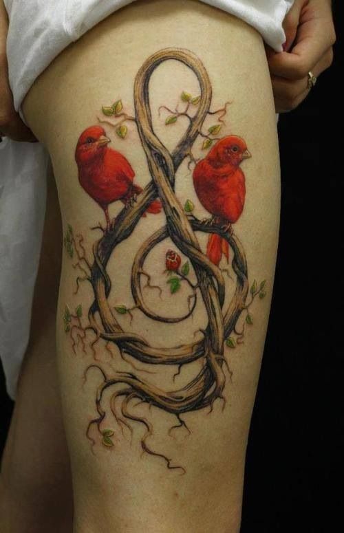 Red lovely bird tattoo on leg