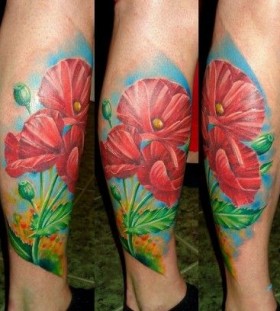 Red lovely poppy tattoo on leg